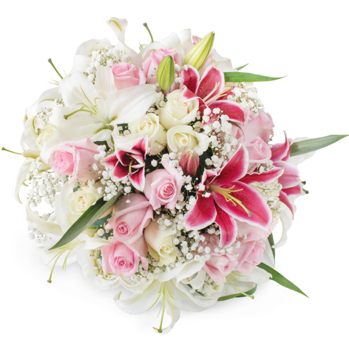A sumptuous, hand-tied bouquet rests against a pure white background, allowing every detail of its lilies, roses, and baby's breath to stand out with clarity, as if you were peering into a florist's chiller in Tulse Hill on a fresh morning. The arrangement is rounded and densely packed, dominated by large white lilies that open into sweeping trumpets, their petals creamy, smooth, and slightly recurved, with greenish throats and pale yellow stamens that lend an air of purity and elegance. Interspersed closely around these are numerous roses in shades of soft blush pink and delicate cream, some still firm and budded with edges just beginning to loosen, others fully open to reveal layer upon layer of velvety petals that seem to glow gently against the white backdrop. Interrupting this gentle palette in the most striking way are several deep pink and fuchsia Oriental lilies, their broad petals etched with darker speckles and rich tones at the centre, creating a vivid focal point that naturally captures the eye. Fine sprays of white gypsophila are threaded through the bouquet, giving it a cloud-like softness and filling every little gap, so the whole piece feels lush yet airy. Slender green foliage and stems peek through at the base and between the flowers, suggesting freshness and the subtle movement of a garden breeze, like you might feel walking up towards Palace Road Nature Garden. The lighting is bright and even, illuminating the varied textures from the satin-like rose petals to the more structured lily blooms and the tiny, papery stars of baby's breath. This bouquet has a mood of refined celebration, perfect for a wedding breakfast near Tulse Hill, an anniversary delivered to a home off Christchurch Road, or a graceful thank-you gift that carries the quiet language of love, admiration, and joy.